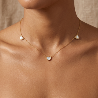 Model wearing 9K Yellow Gold 3 Mother Of Pearl Heart Necklace - Sonny's Jewellers