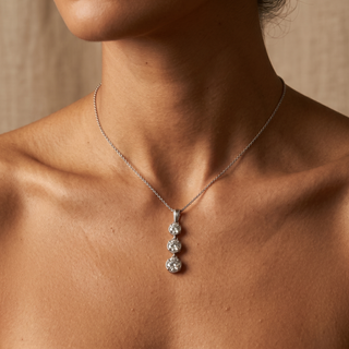 Model wearing 9K White Gold 3-Stone Diamond Pendant - Sonny's Jewellers