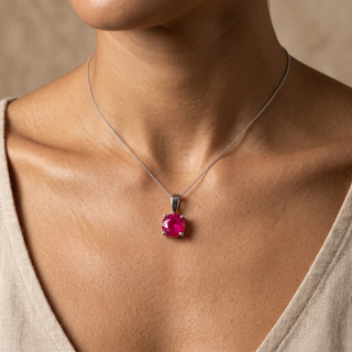 Model wearing 9K White Gold Round Ruby Claw Pendant - Sonny's Jewellers