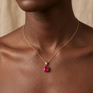 Model wearing 9K Yellow Gold 5mm Round Ruby Pendant - Sonny's Jewellers