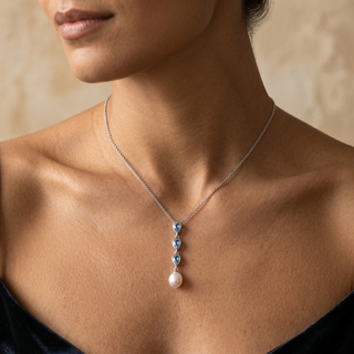 Model wearing 9K White Gold Blue Topaz & Pearl Pendant - Sonny's Jewellers