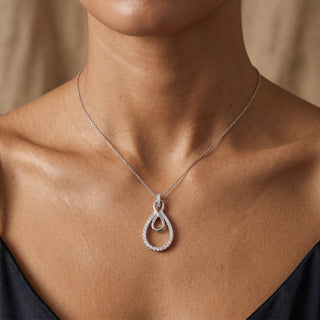 Model wearing 9K White Gold Diamond Drop Infinity Pendant - Sonny's Jewellers