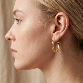 Model wearing 9K Yellow Gold Double Oval Creole Earrings - Sonny's Jewellers