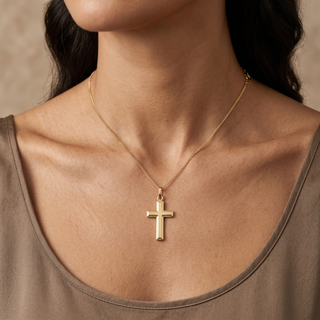 Model wearing 9K Yellow Gold Bevelled-Edge Cross Pendant - Sonny's Jewellers