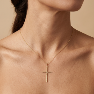 Model wearing 9K Yellow Gold Diamond Cut Slim Cross Pendant - Sonny's Jewellers