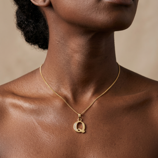 Model wearing 9K Yellow Gold CZ 'Q' Initial Pendant - Sonny's Jewellers