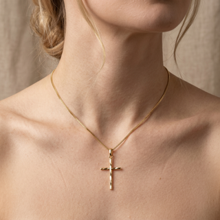 Model wearing 9K Yellow Gold Diamond Cut Cross Pendant - Sonny's Jewellers