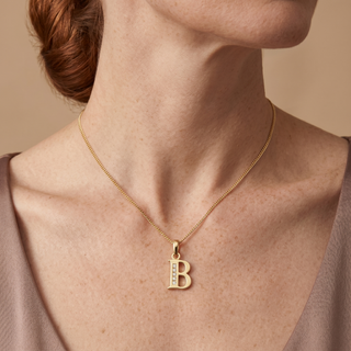 Model wearing 9K Yellow Gold CZ 'B' Initial Pendant - Sonny's Jewellers