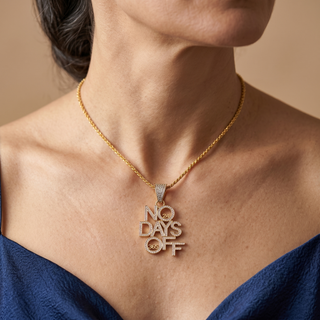 Model wearing 9K Yellow Gold CZ Motto Pendant - Sonny's Jewellers