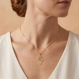 Model wearing 9K Yellow Gold Diamond Cut Hamsa Pendant - Sonny's Jewellers