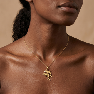 Model wearing 9K Yellow Gold Double Dolphin Pendant - Sonny's Jewellers