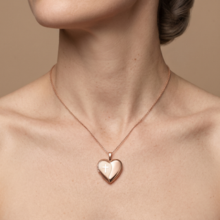 Model wearing 9K Rose Gold Etched-Cross-Detail Heart Locket - Sonny's Jewellers