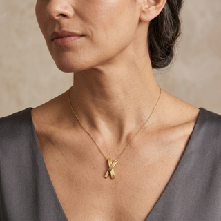 Model wearing 9K Yellow Gold Kiss Pendant - Sonny's Jewellers