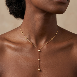 Model wearing 9K Yellow Gold Diamond Cut Ball Y Necklace - Sonny's Jewellers