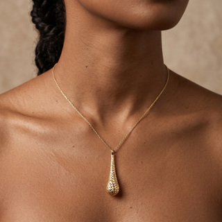 Model wearing 9K Yellow Gold Diamond Cut Teardrop Necklace - Sonny's Jewellers